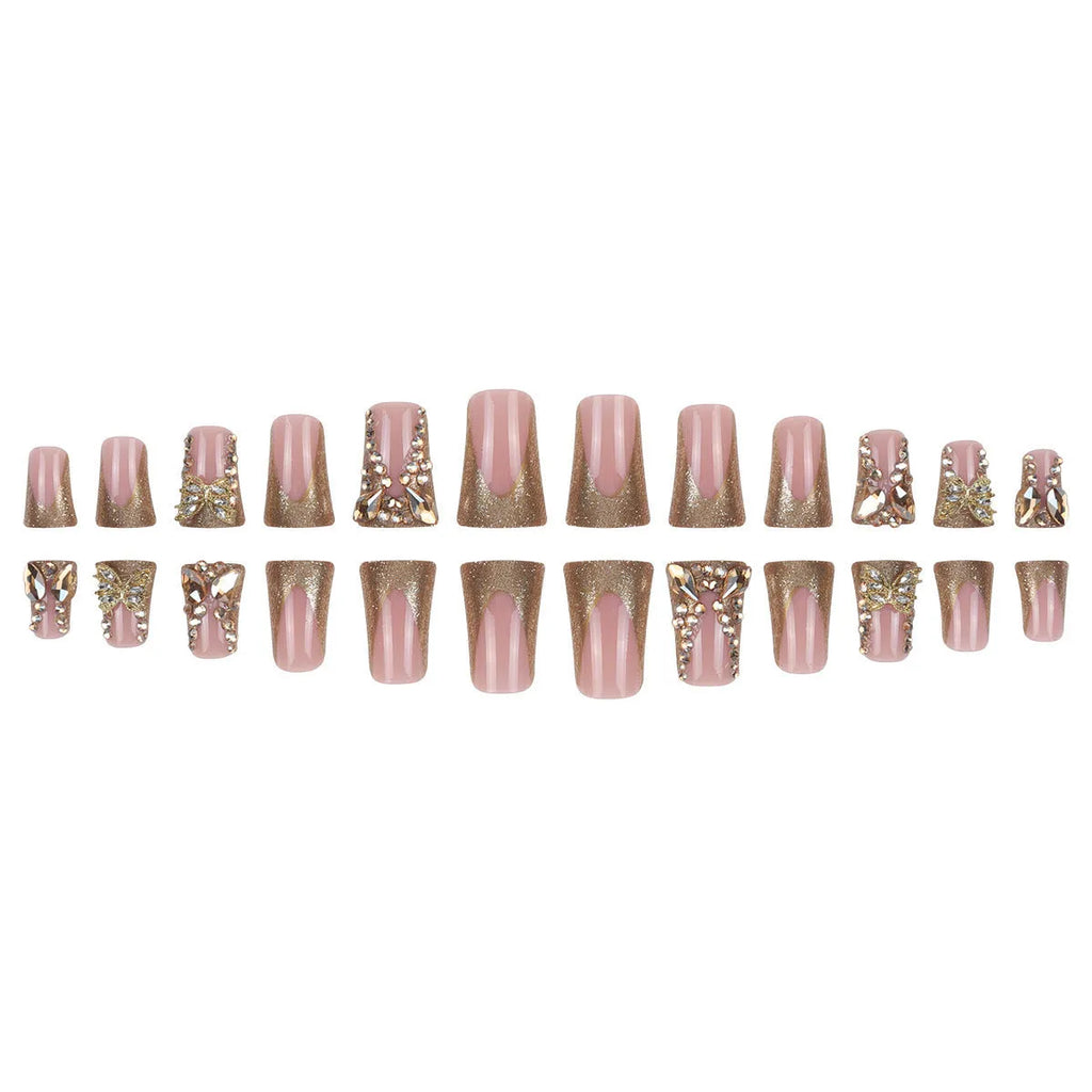 Golden diamond and butterfly design nail stickers on nails with debris texture, part of a 24-piece DIY kit.