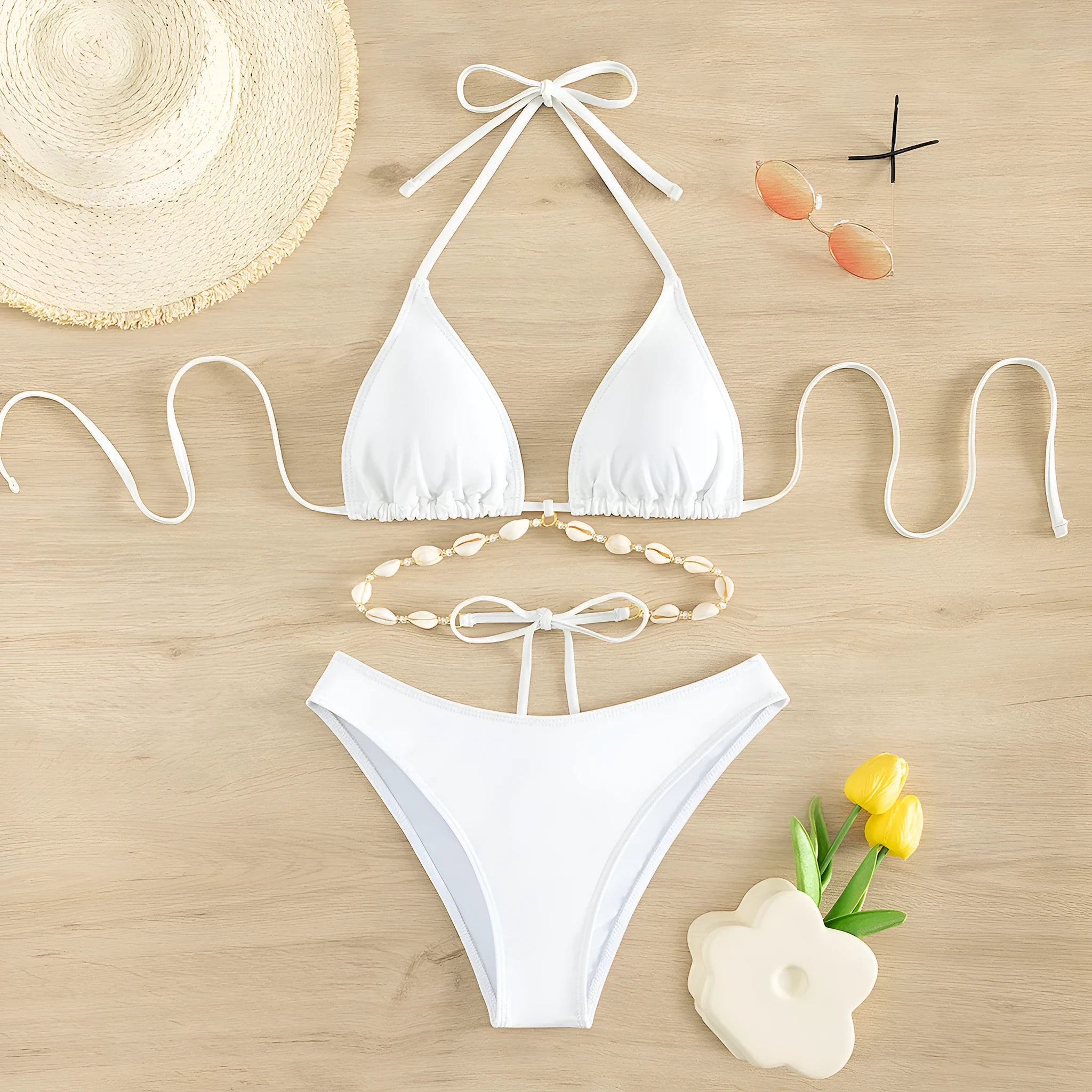 Women's black and white halter neck bikini with lace-up back.