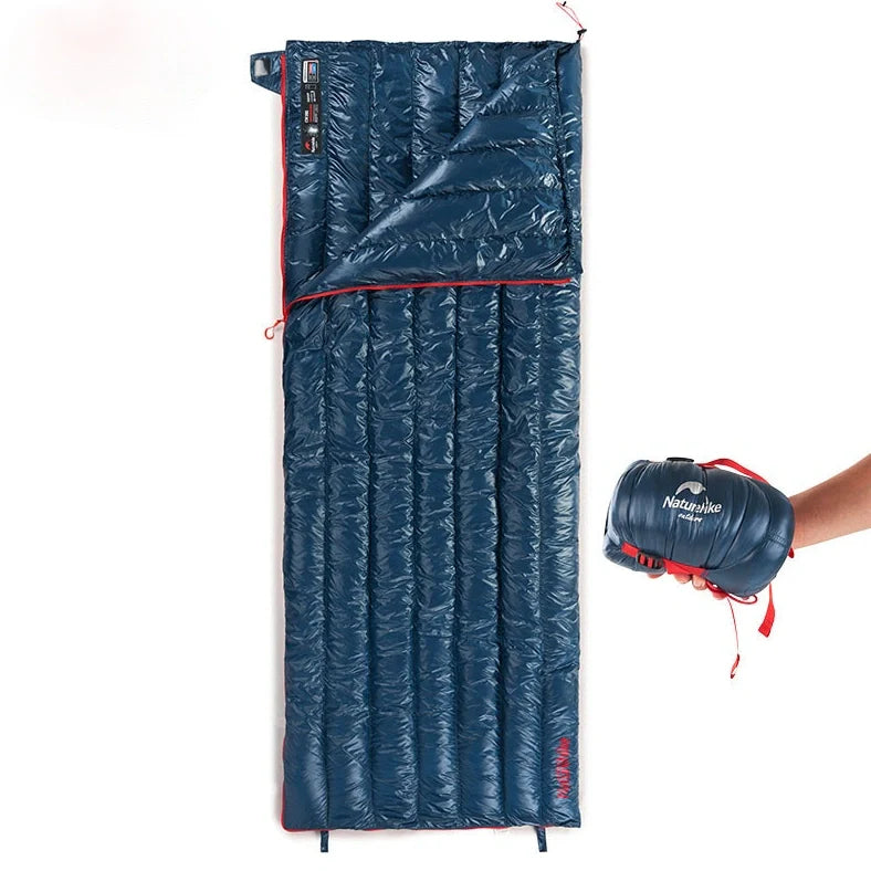 Camping sleeping bag with 90% white duck down filling and waterproof 15D 410T nylon fabric, offering warmth retention in temperatures down to -5°C with a compressible design reducing packed size by 60%