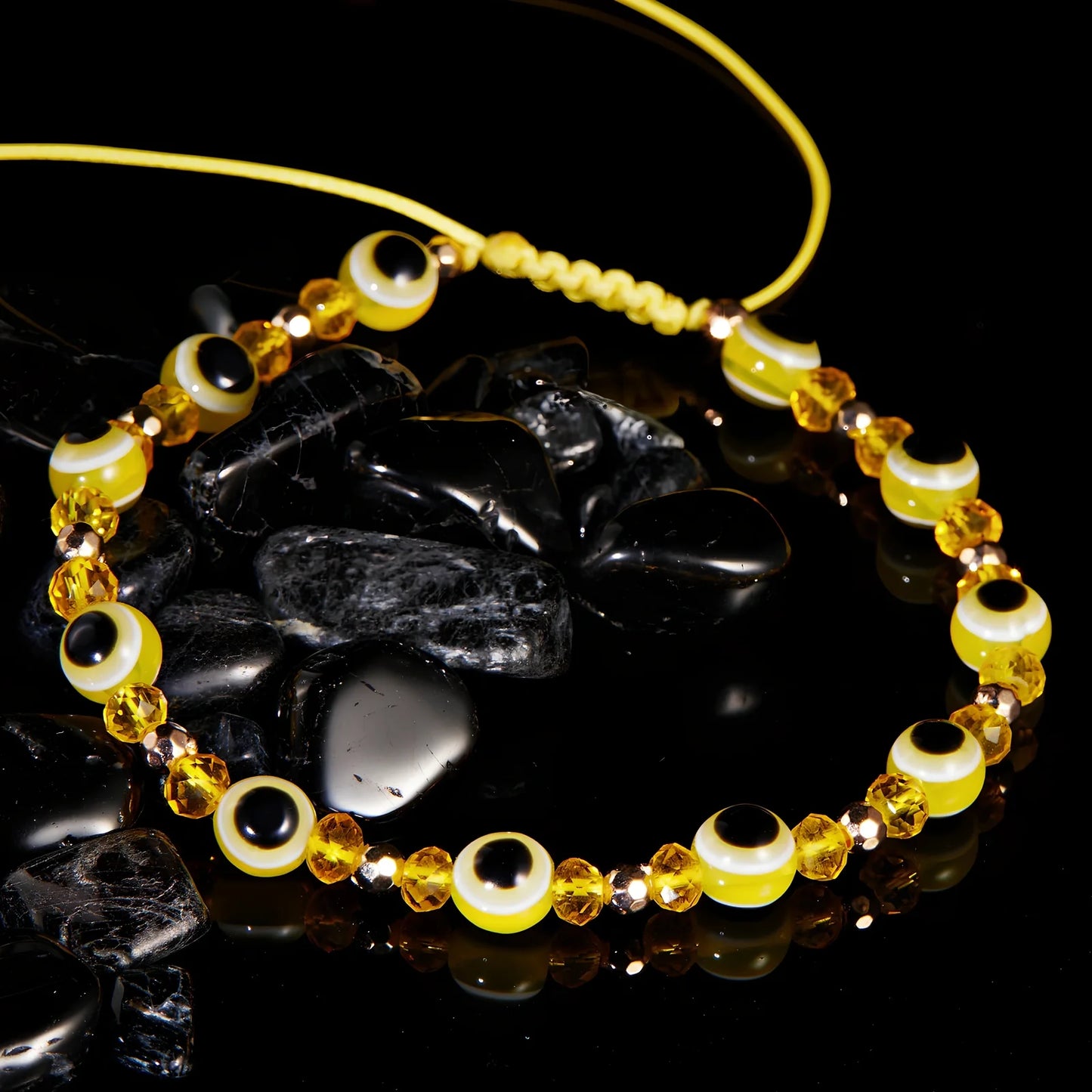 Adjustable crystal bead bracelet with blue eye design on braided rope, fits 15-19cm wrists