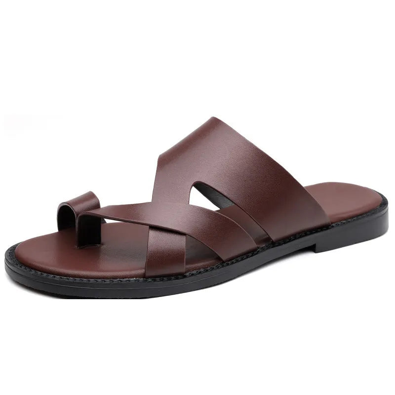 Simple Leisure Seaside Beach Slippers in dark brown with rubber sole, side view on sand