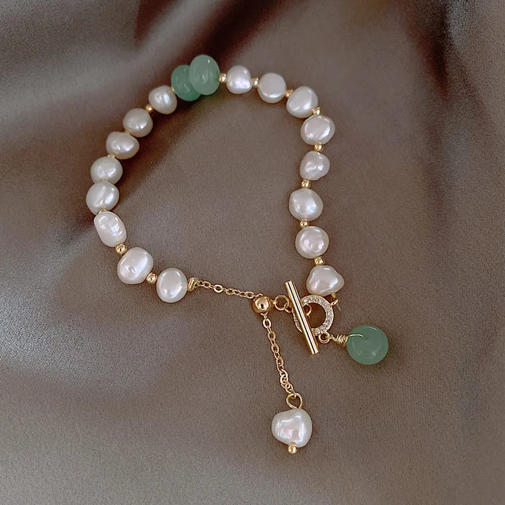 Women's irregular freshwater pearl adjustable bracelet on a plain background showing the alloy clasp and irregular pearl beads