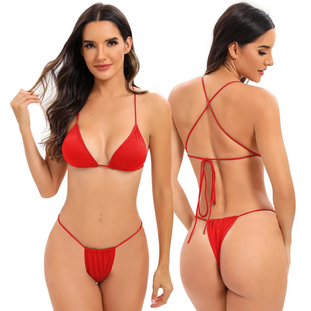Women's candy coloured cross strap bikini swimsuit with multiple adjustable straps on a mannequin.