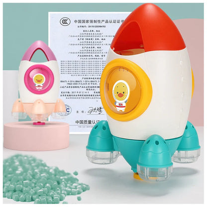 Dinosaur-shaped baby bath toy with manual water spray function in bright colours