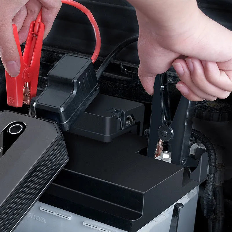 Baseus Super Energy Max black portable car jump starter with 20000mAh battery and 2000A peak current on a dark background