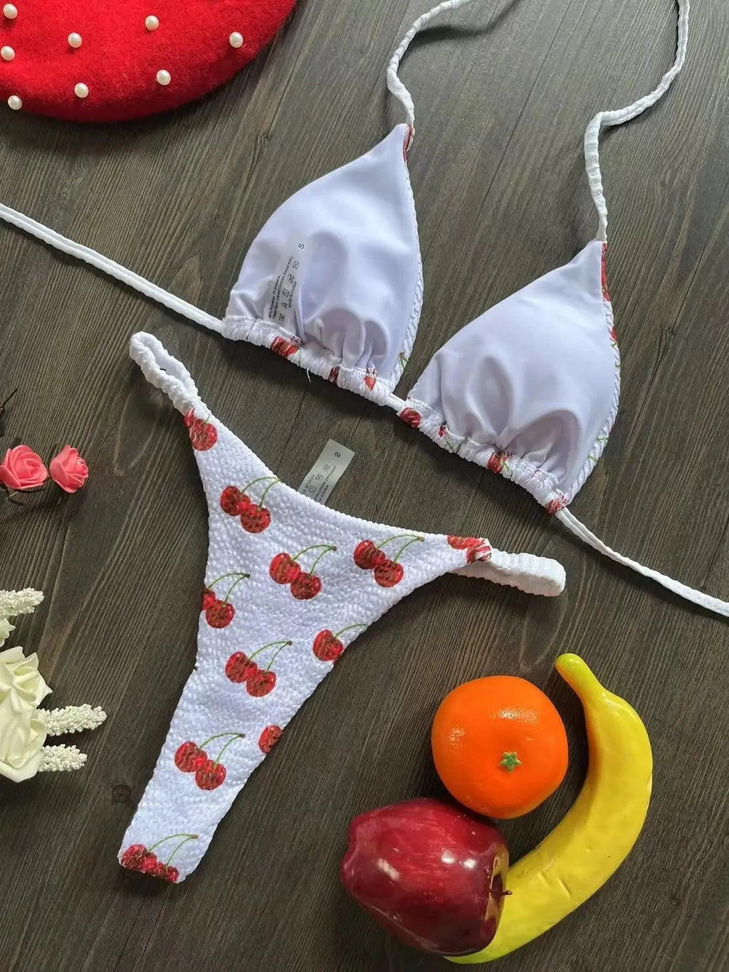 Women's printed bikini swimsuit with briefs style on a mannequin, showing the cotton lining and high elasticity fabric.