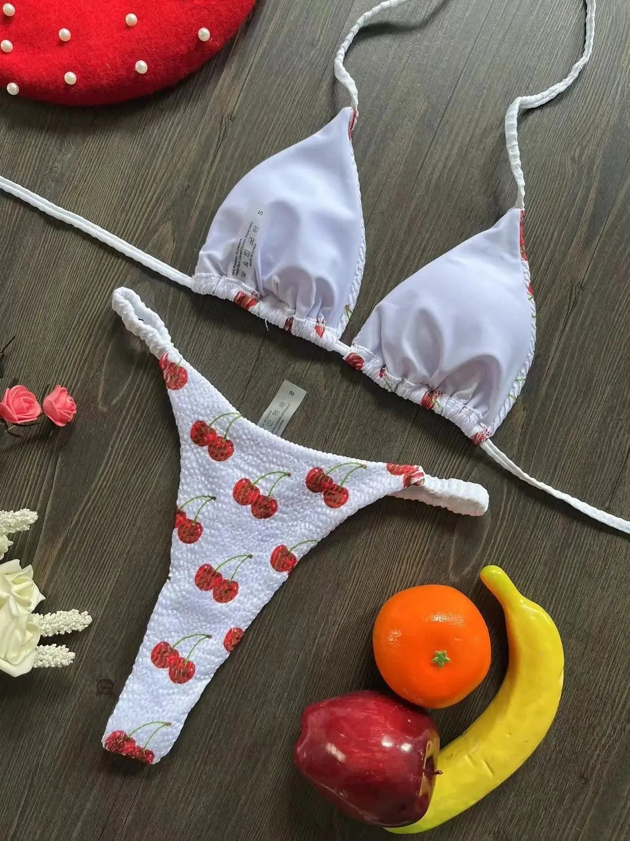 Women's printed bikini swimsuit with briefs style on a mannequin, showing the cotton lining and high elasticity fabric.