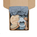 Newborn baby shower toy set with 6 bath toys in peach, blue, and brown from wood and chemical fibre