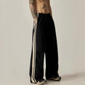 Black wide leg climbing pants for men showing high waist and straight leg design