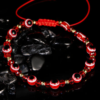 Adjustable crystal bead bracelet with blue eye design on braided rope, fits 15-19cm wrists