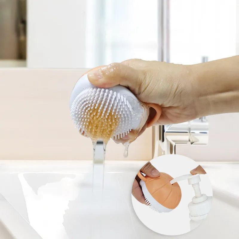 Orange dog bath brush with shampoo dispenser and soft TPR bristles for pet grooming
