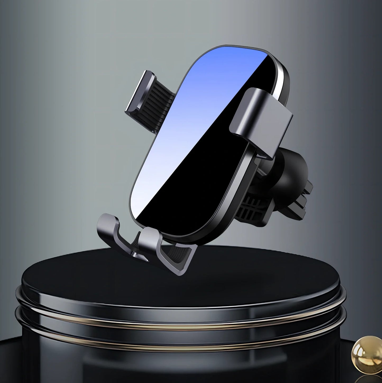 Black sucker car phone holder mounted on dashboard with phone clamped, showing suction base and USB cable, 12cm height