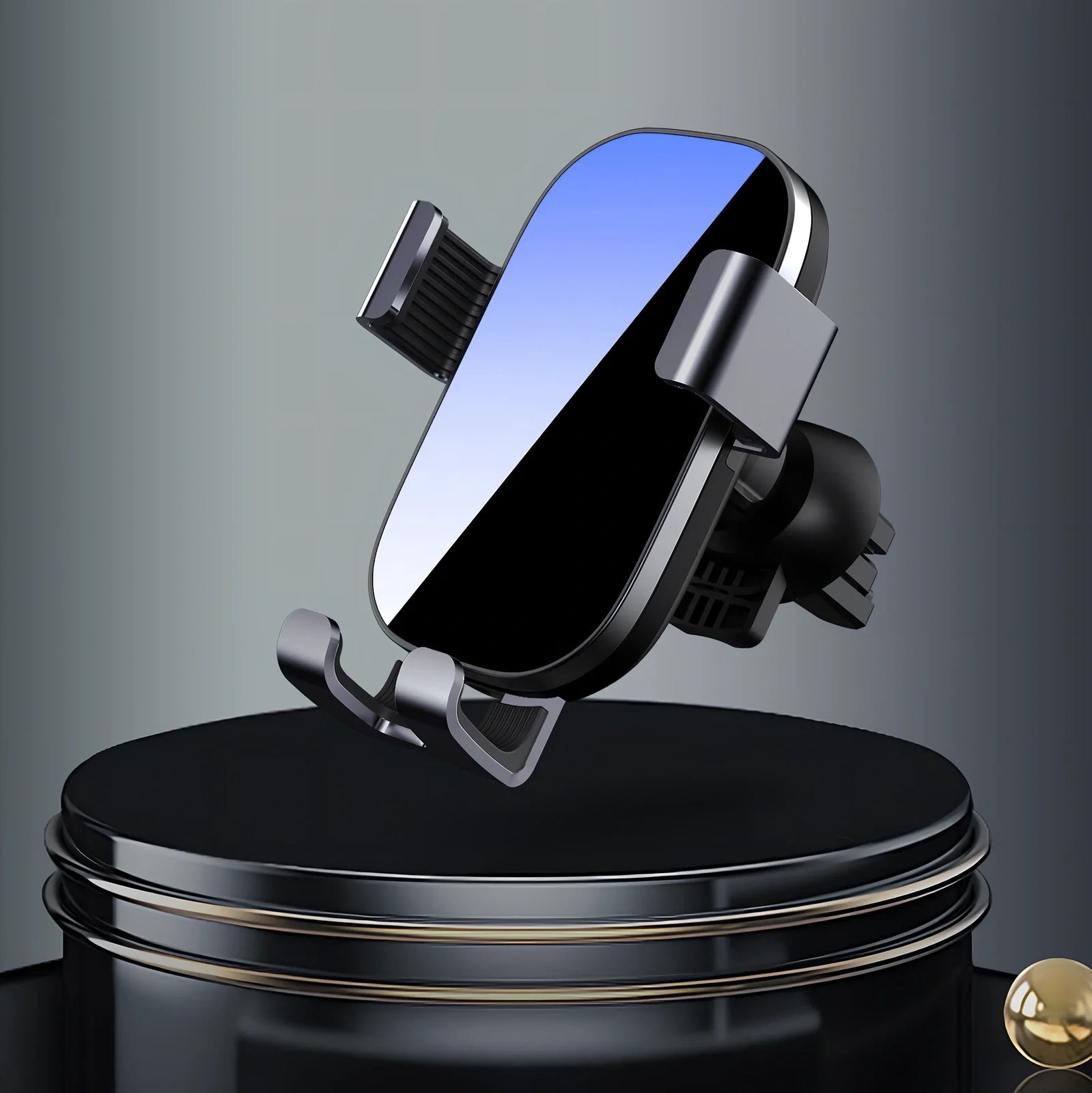 Black sucker car phone holder mounted on dashboard with phone clamped, showing suction base and USB cable, 12cm height