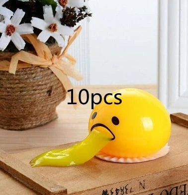 Gudetama Vomiting Egg Toy in green, orange, pink, and yellow