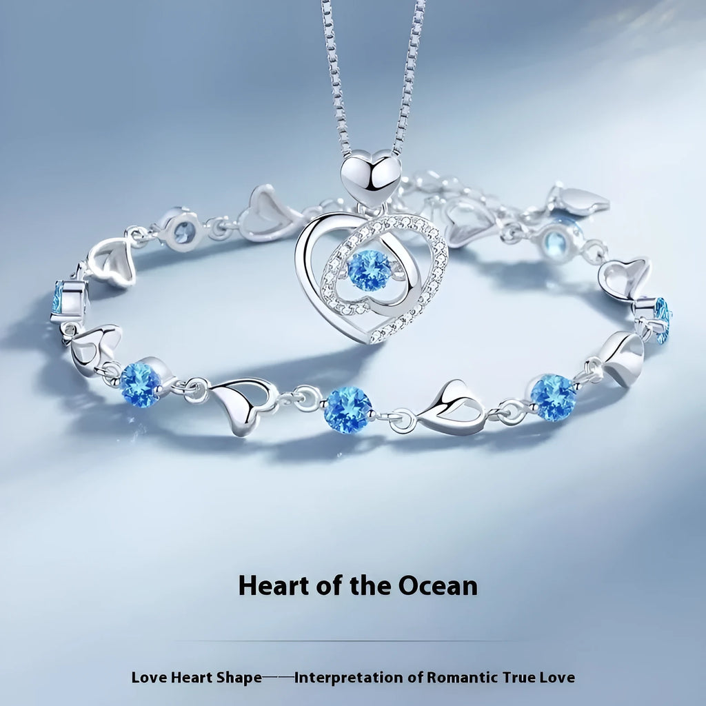 Blue diamond electroplated heart pendant necklace and matching bracelet set on a copper chain.
