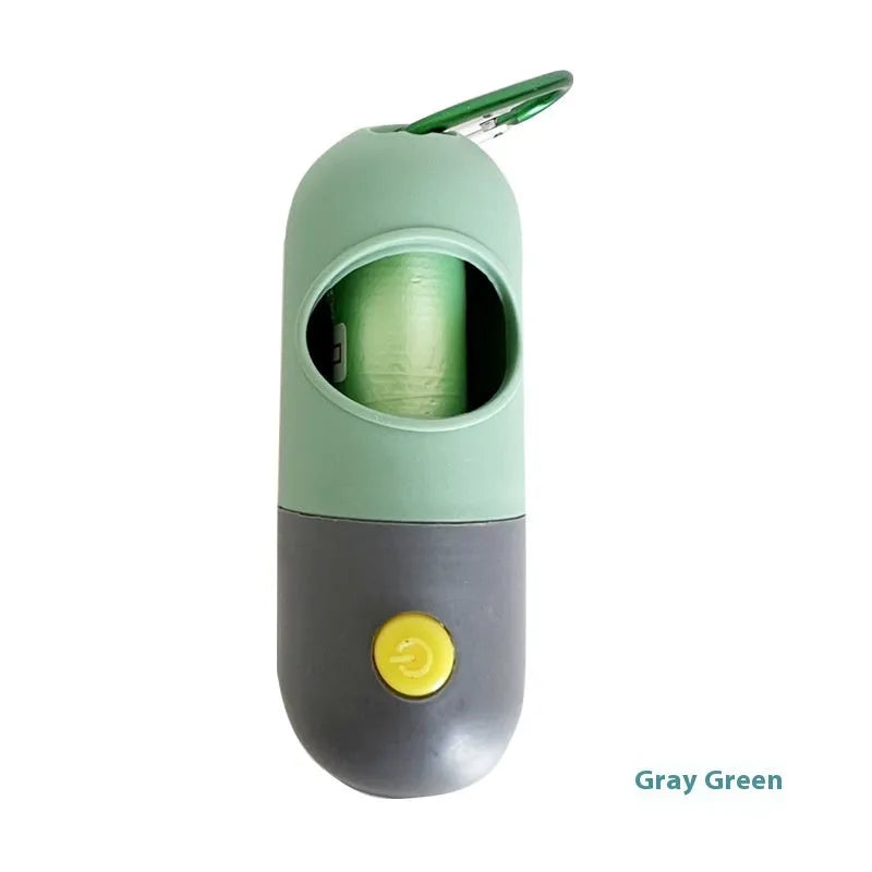 Compact LED pet waste bag dispenser in blue grey with a dog lead attachment and illuminated button