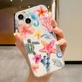 Transparent TPU iPhone case with painted dolphin and turtle design on a phone.