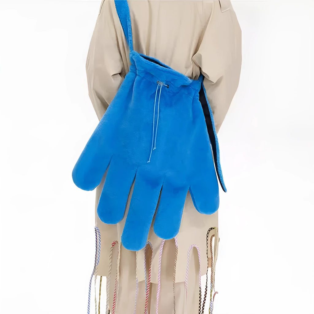 Blue fur 14-inch crossbody bag with velvet lining and sewing thread details, shown on a model for scale