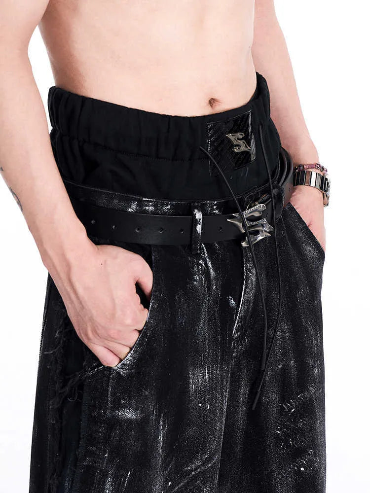 Black men's leather belt with a detailed metal letter buckle on a white background.