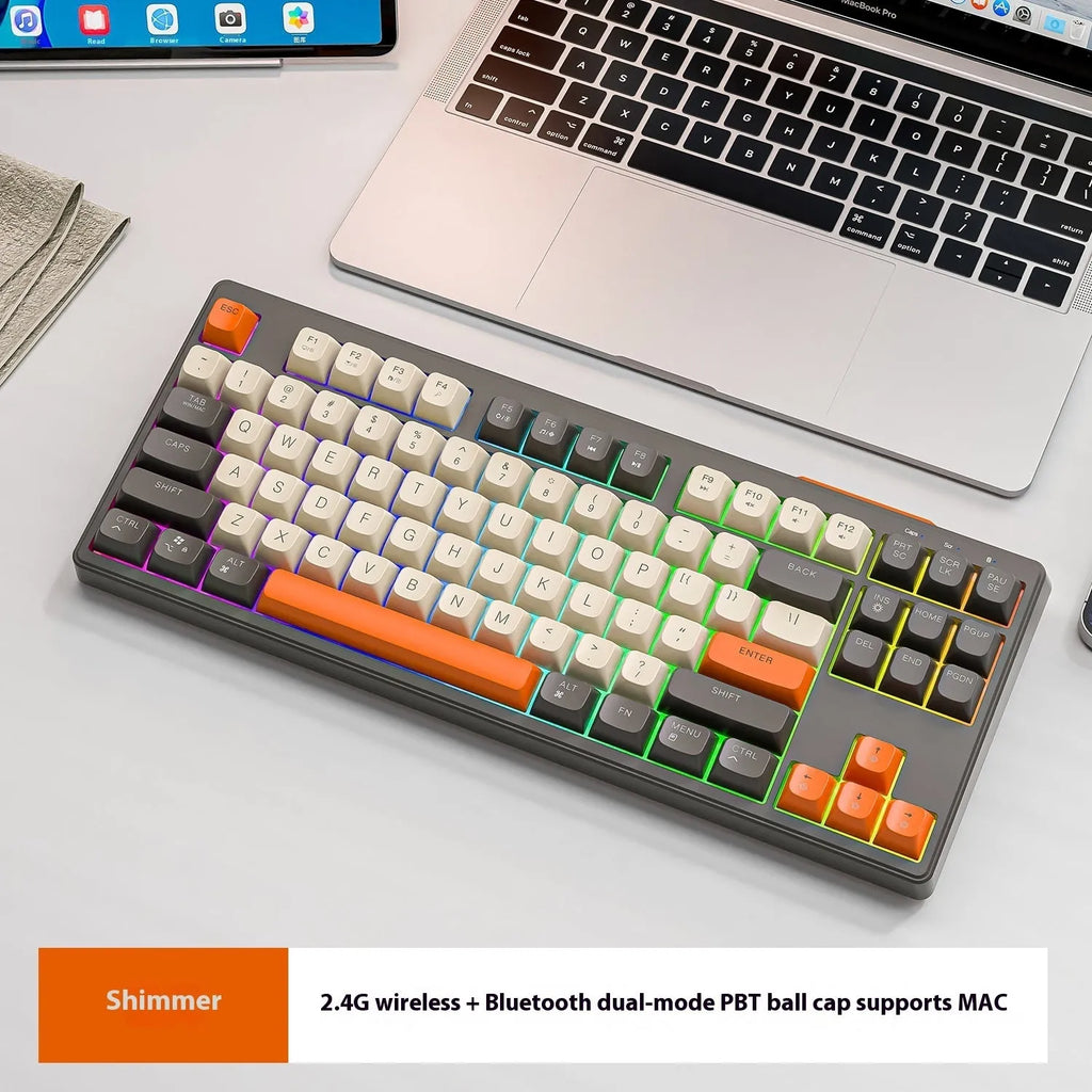 Free Wolf M87 wireless Bluetooth dual-mode keyboard shown in one of four colour options: blueberry, cheese, coffee, or shimmer.