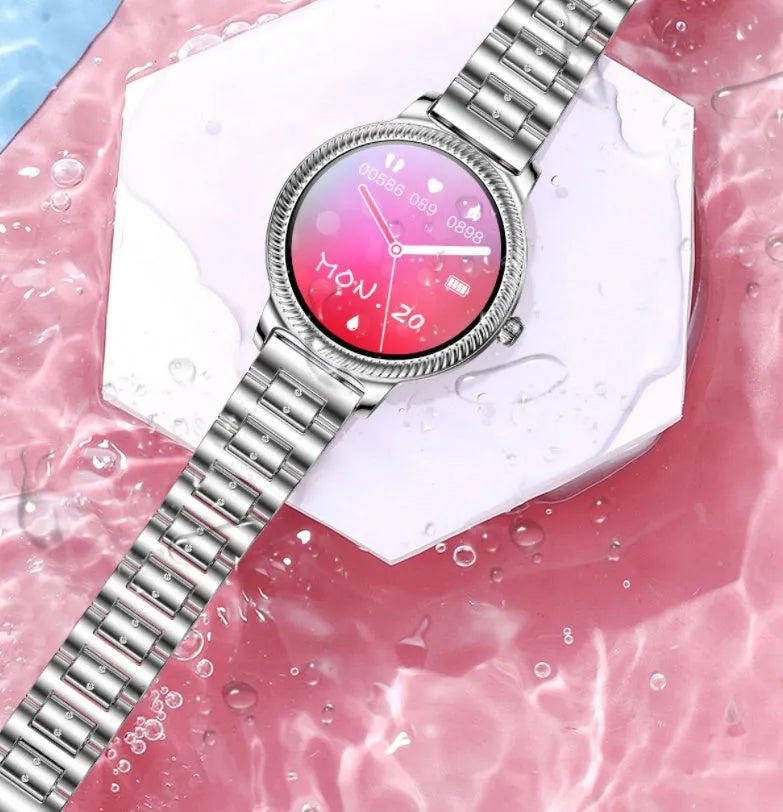 AK38 ladies smart watch with stainless steel band on wrist, showing colour screen.