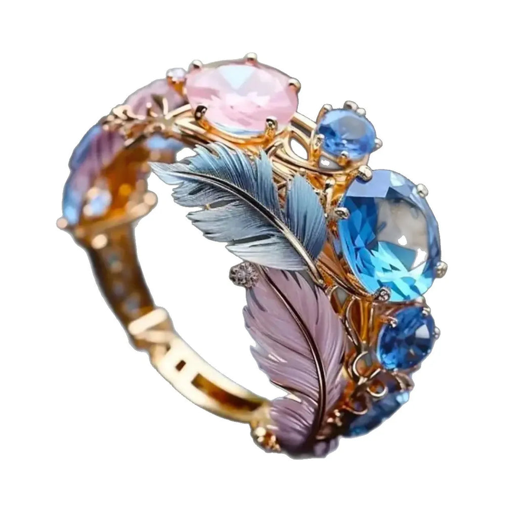 Gold brass feather ring with geometric design and zircon detailing