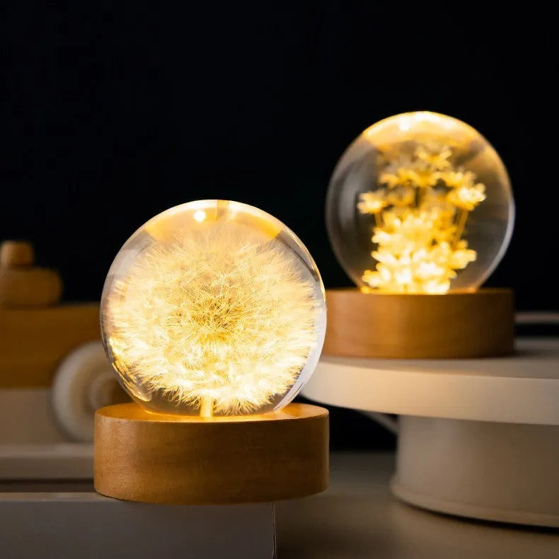 3D dandelion crystal ball desk lamp on beech wood stand, serving as a USB night light.