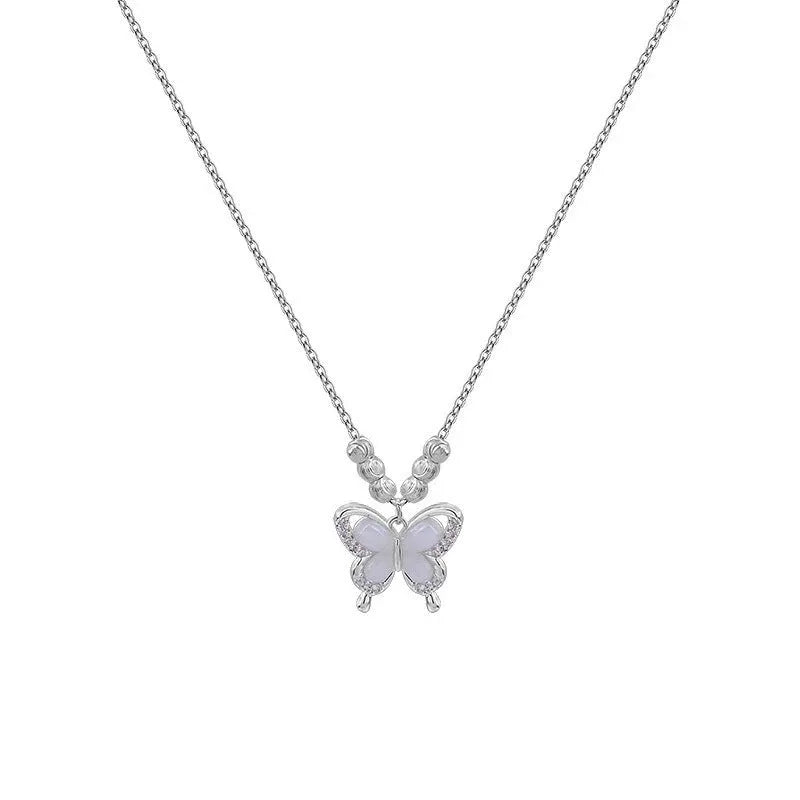 Silver necklace with a square opal butterfly pendant on a cross chain, shown against a white background.