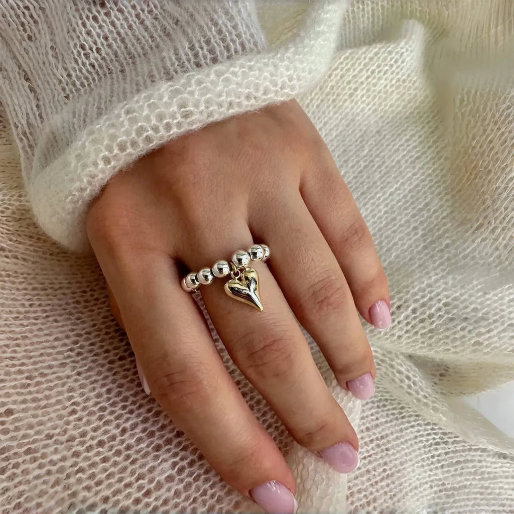 Handmade beaded elastic ring with geometric heart design in gold or silver electroplated finish