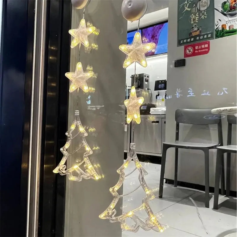Set of three battery-powered LED Christmas pendant lights with suction cups for window decoration