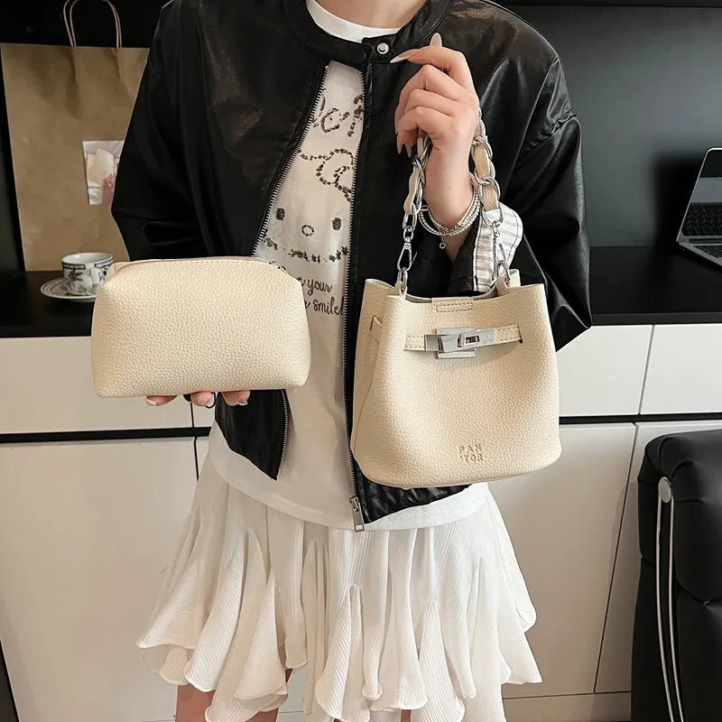 Soft PU leather retro bucket shoulder bag with chain detail in four colour options.