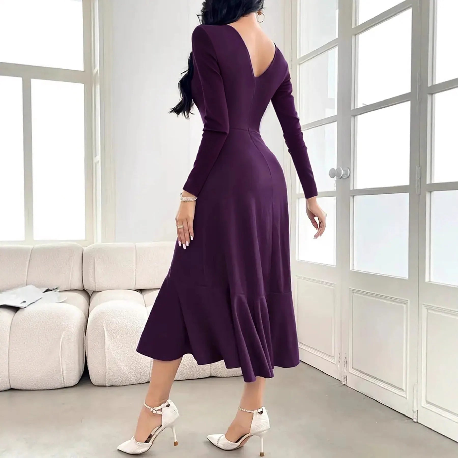 Purple women's long sleeve dress with ruffles and a round neck, showing a mid-waist fit.