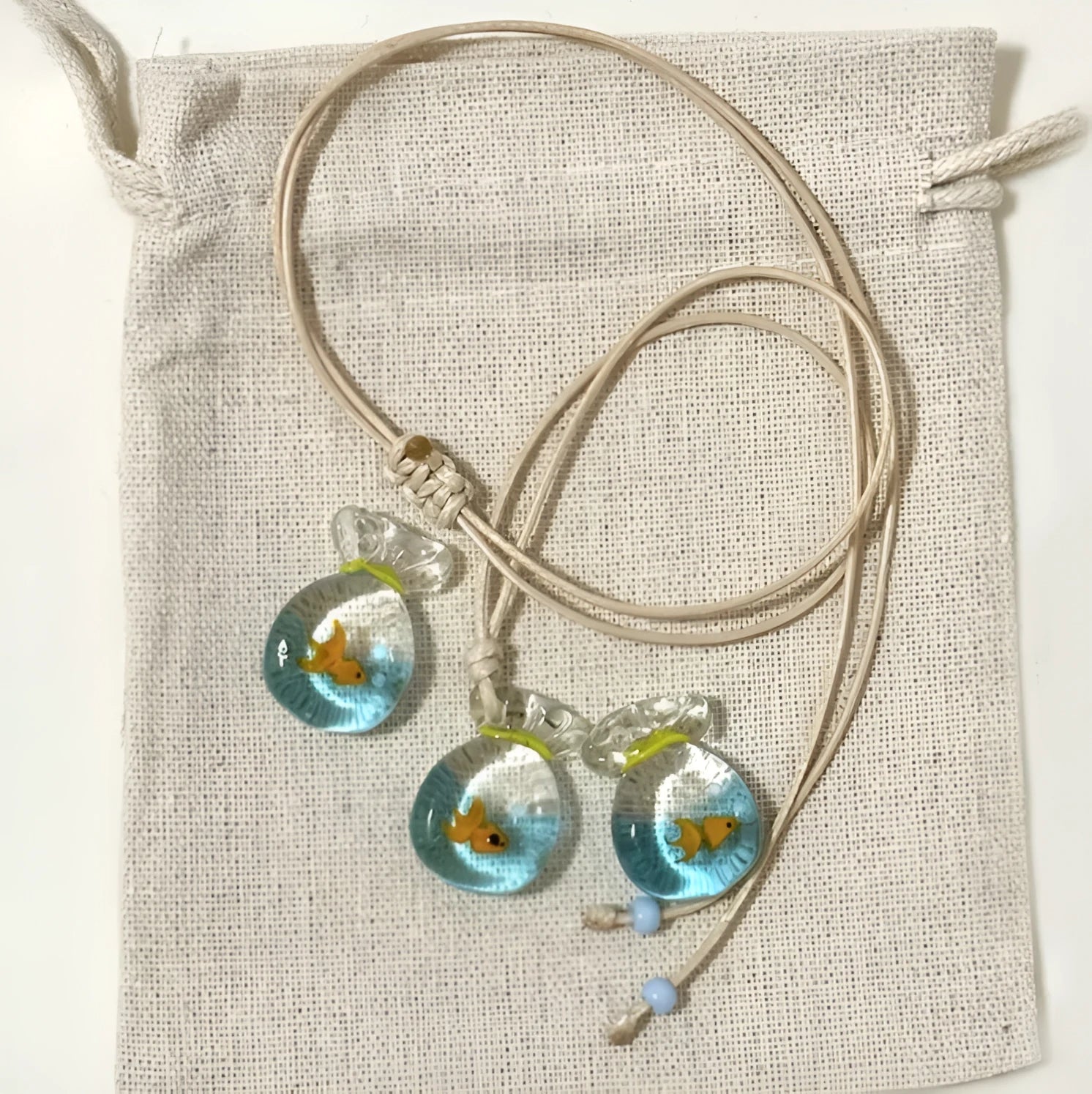 Women's skirt-shaped joker pendant necklace on a cotton and linen clavicle chain.
