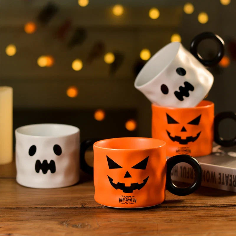 Pumpkin-shaped ceramic mugs in orange and white colors, perfect for enjoying hot drinks during the holidays