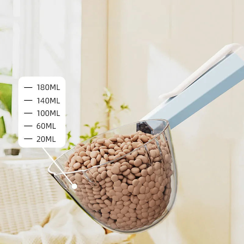 Blue plastic pet food spoon with a built-in fastener clip for dogs and cats.