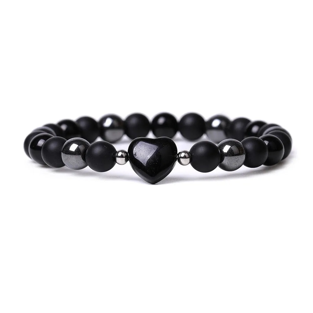 Hand-cut geometric peach heart stone bracelet with moon and planet decorative elements in eight colour options