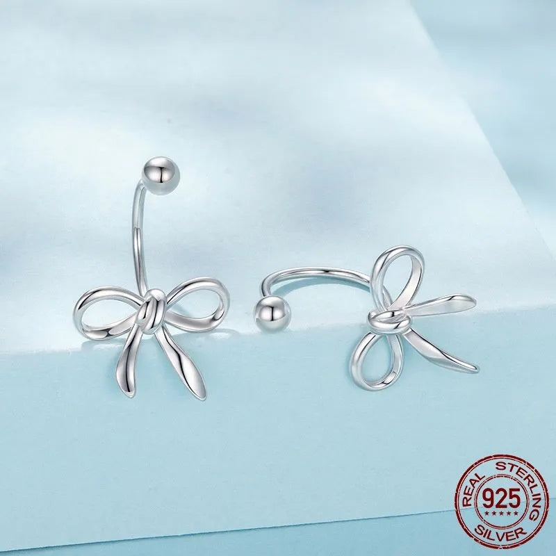 Women's S925 sterling silver bow stud earrings, polished silver finish, 1.2 cm bow shape on white background