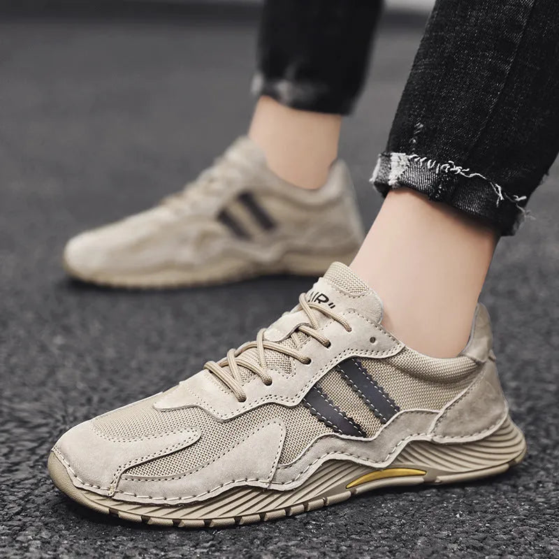 Men's low-top lace-up hiking boots in grey with pigskin upper and platform rubber sole.
