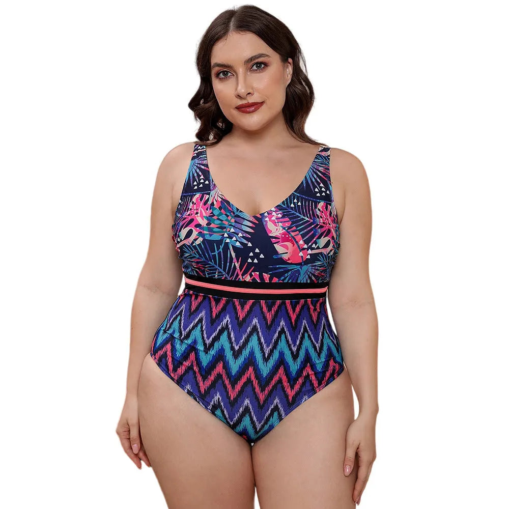 Women's blue printed one-piece swimsuit with spaghetti straps and a striped vest design laid flat.