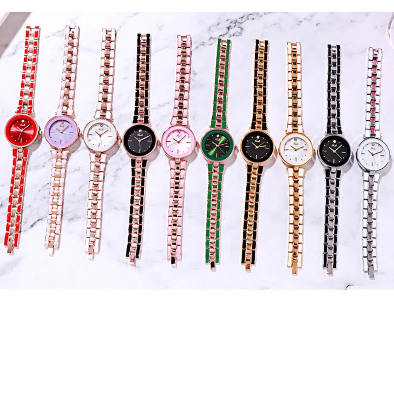 White dial ladies quartz watch with rose gold accents, steel strap, 30mm round alloy case on flat surface