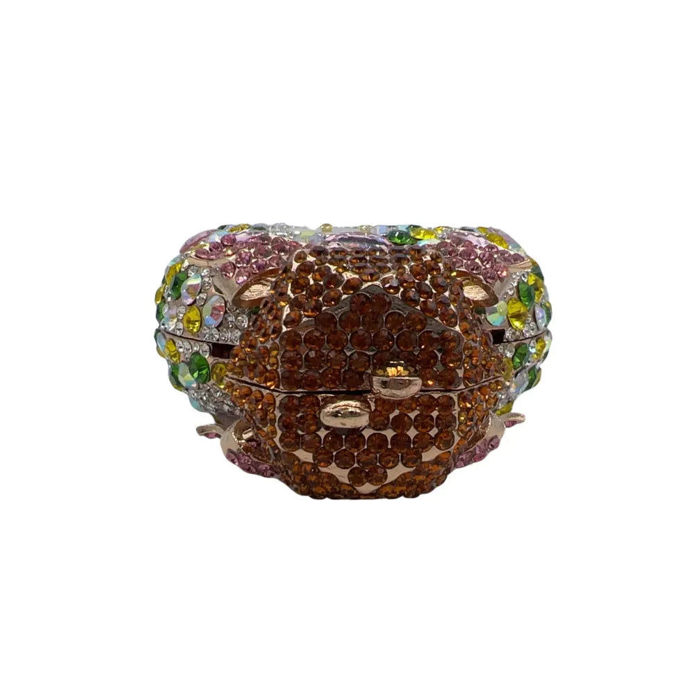 Golden women's hard shell clutch bag covered in sparkling diamonds for formal events.