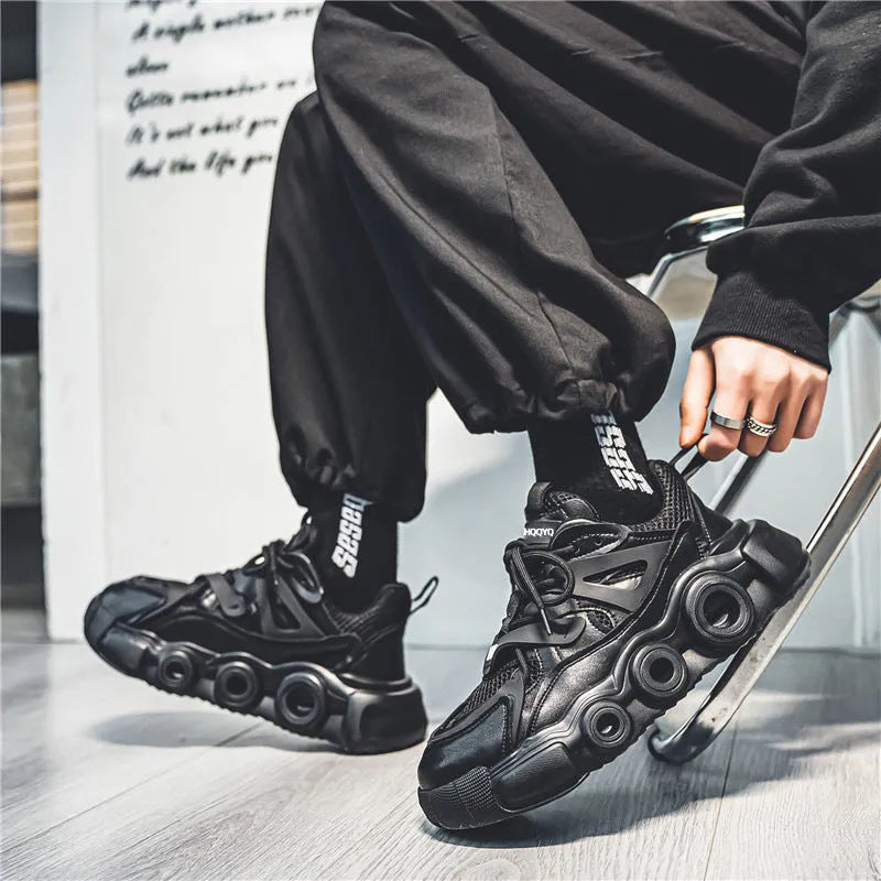 Men's black casual sneakers with a breathable mesh upper and thick rubber sole for height increase