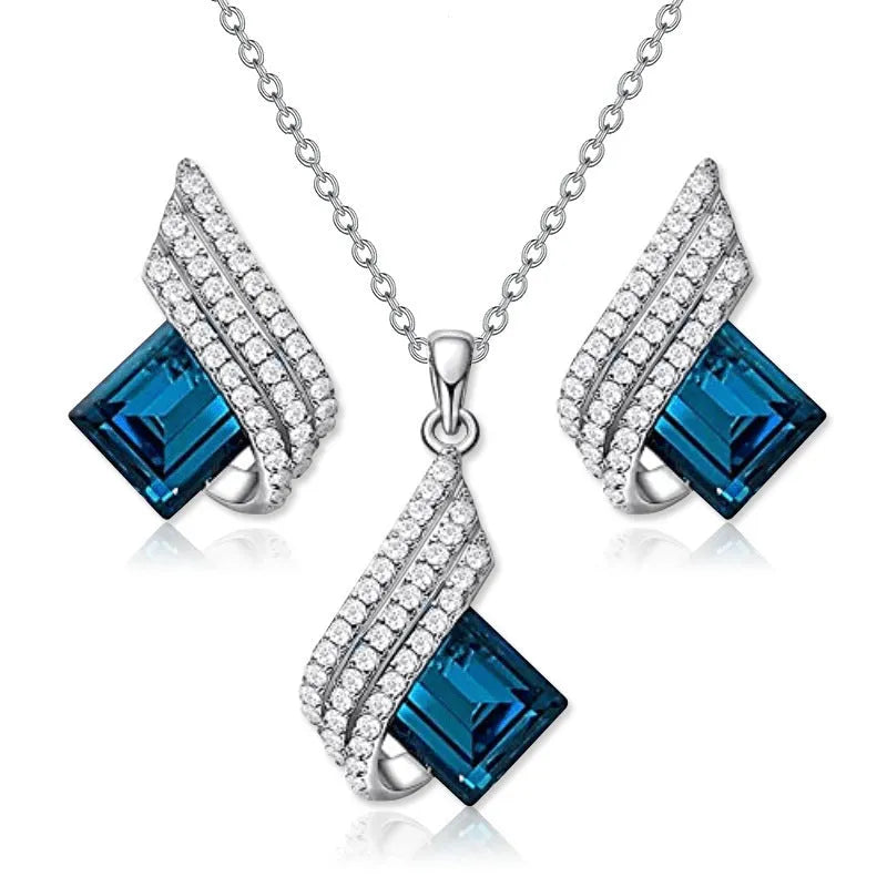 Women's alloy pendant necklace and matching stud earrings set with cross chain and glass accents