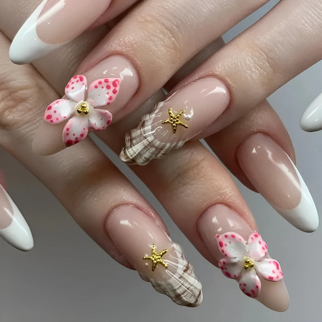French style fake nails with simple flower patterns and rock accents on white background