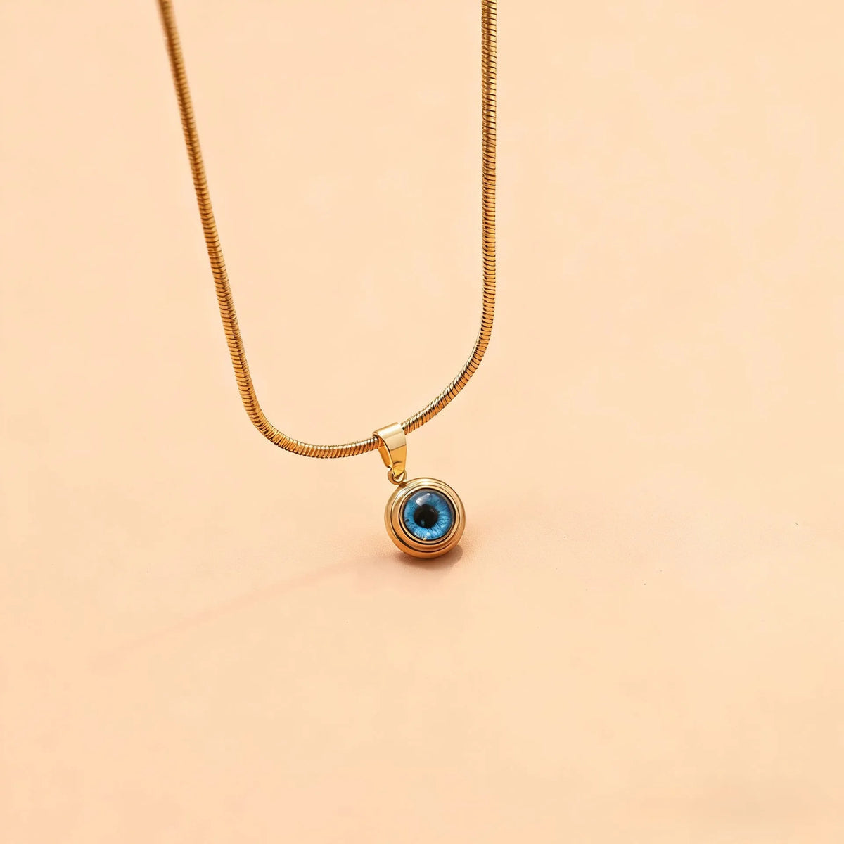 Angel Eyes titanium steel necklace with gold plating and coloured glaze eye pendant on snake bones chain