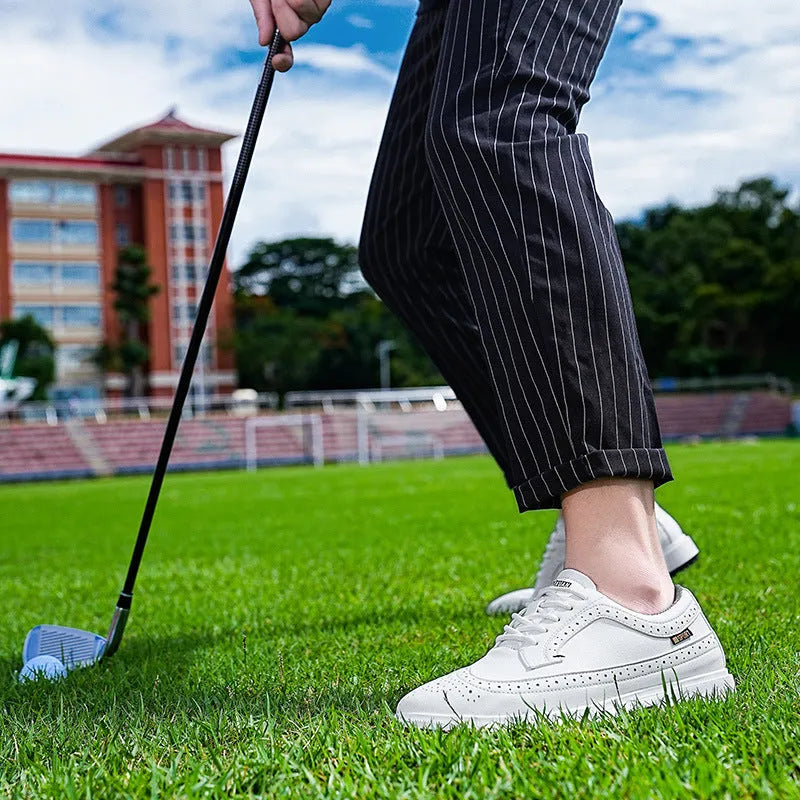 Men's Lake Blue genuine leather golf shoe with non-slip rubber sole on a golf course.