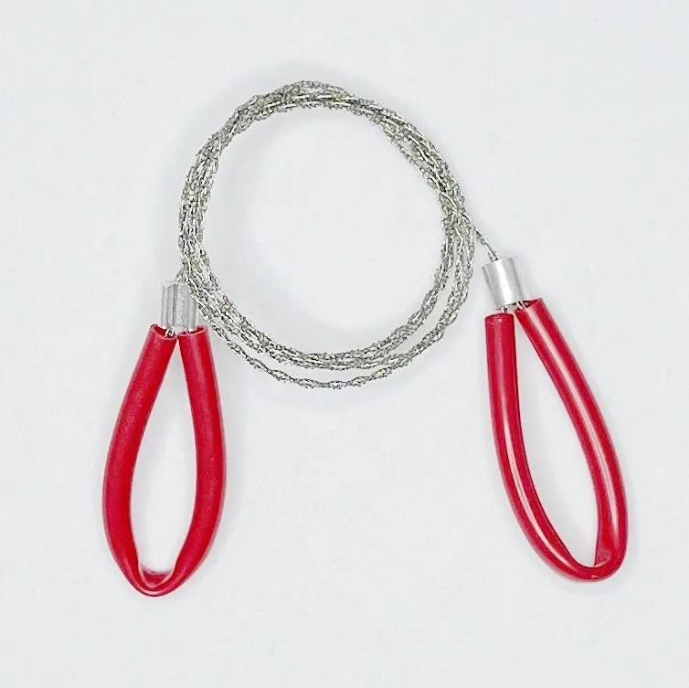 Outdoor survival wire saw with a stainless steel wire coil presented next to a small black leather carry case.