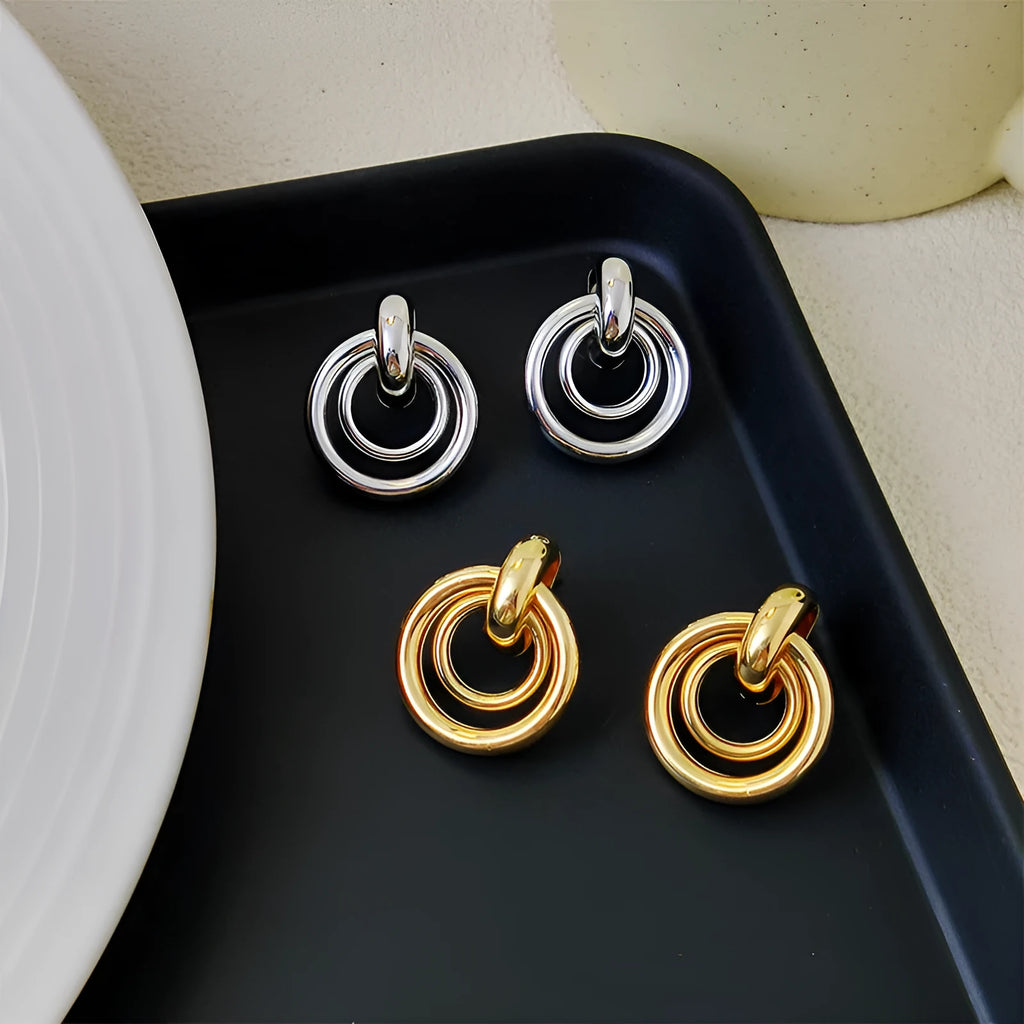 Geometric round ring earrings with irregular design in gold and silver colour options