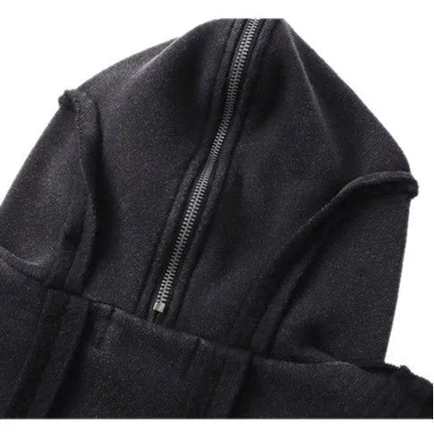 Black loose-fit padded cotton cardigan with a zip front and hood on a model.