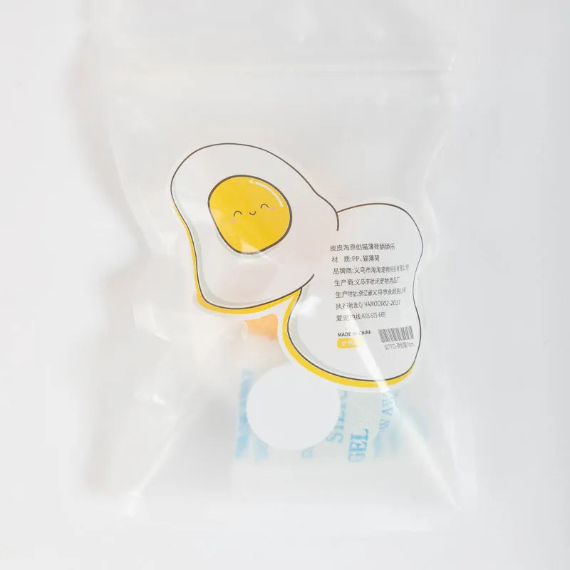 Interactive catnip ball toy for cats in fried egg and poached egg shapes with wall mount feature